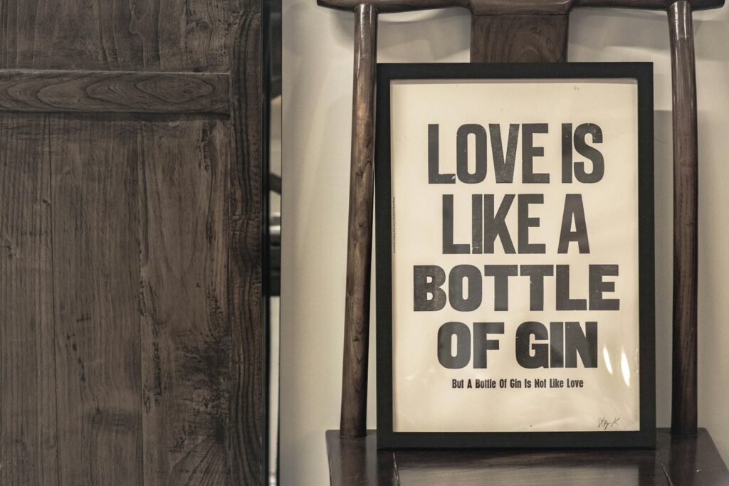 love is like a bottle of gin signage